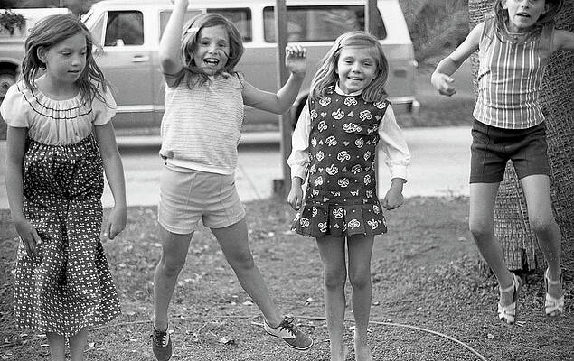 Phoenix Photograph - Four Girls, Jumping, 1972 by Jeremy Butler