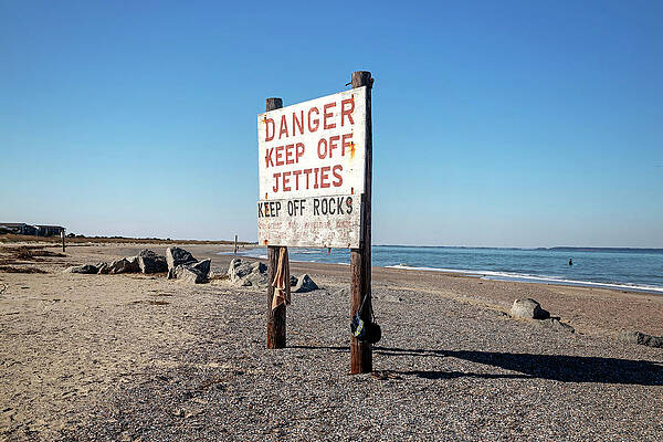 North America Wall Art featuring the digital art Georgia, Tybee Island, Danger Keep Off Jetties Sign On North Beach. by Lumiere