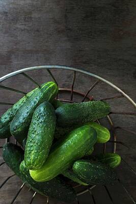 Gherkins In A Wire Basket On A Wooden Table Top Print