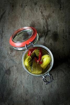 Gherkins With Chillis In A Preserving Jar On A Wooden Table Print