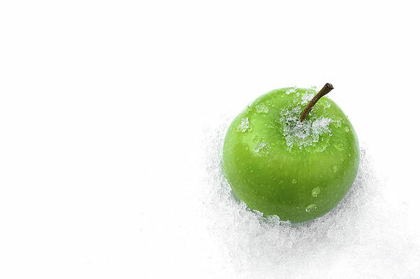 Winter Photograph - Green Apple And Snow by Tatiana Travelways