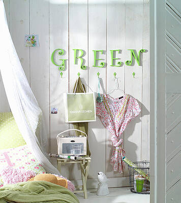 Green Letters On Wall Above Coat Pegs In Bedroom Print