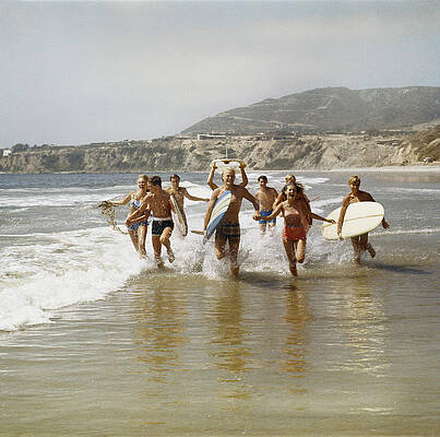 Surfers Running From the Ocean Wall Art