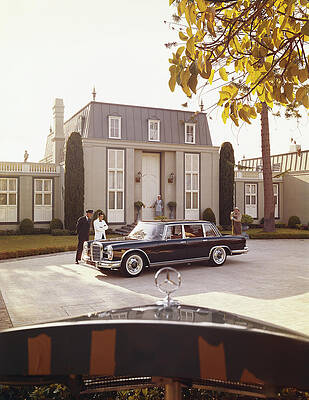 Wall Art featuring the photograph House Workers And Staff Looking At Car by Tom Kelley Archive