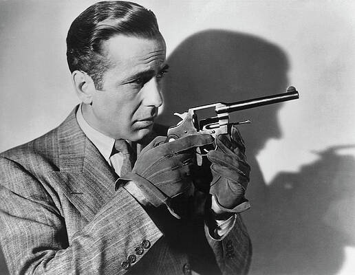 Wall Art featuring the photograph Humphrey Bogart With A Gun by Archive Photos