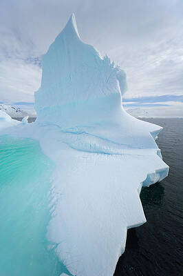 Wall Art featuring the photograph Iceberg And Clouds, Antarctic Peninsula by Eastcott Momatiuk