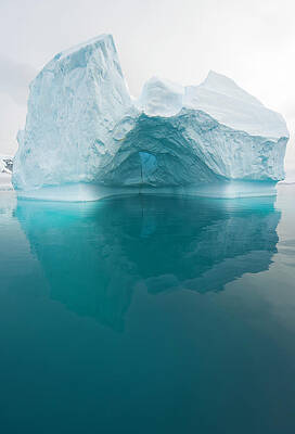 Solitary Iceberg Reflecting in Calm Waters Wall Art