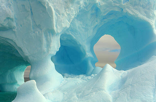 Wall Art featuring the photograph Iceberg With Arches, Antarctic Peninsula by Eastcott Momatiuk