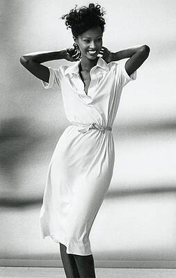 Wall Art featuring the photograph Iman Wearing A White T-shirt Dress by Kourken Pakchanian