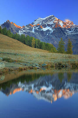 Small Digital Art - Italy, Aosta Valley, Aosta District, Valle Del Gran San Bernardo, Valpelline, Alps, The Grand Combin Is Reflected At Dawn In A Small Lake In Champillon, Above The Village Of Doues by Davide Carlo Cenadelli