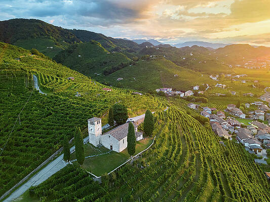 Wine Wall Art featuring the digital art Italy, Veneto, Treviso District, Prosecco Road, Prosecco Hills, Col San Martino, Sunrise On The Church Of San Vigilio by Franco Cogoli