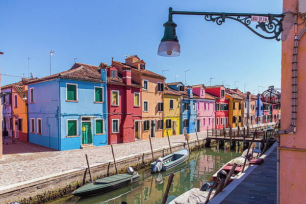 Lamp Wall Art featuring the digital art Italy, Veneto, Venezia District, Venice, Burano, Venetian Lagoon, Adriatic Coast, View Of The Colorful City Of Burano And A Typical Street Lamp by Manfred Bortoli