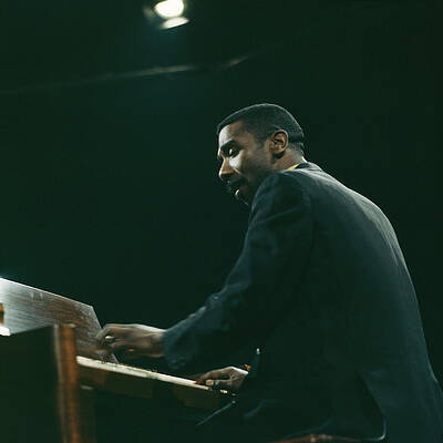 Pianist Performing on Stage Photograph