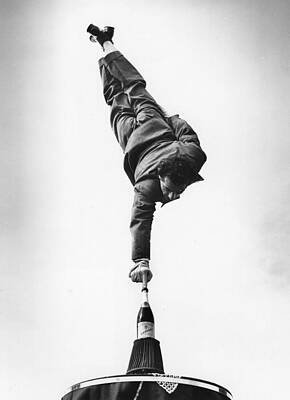 Man Balancing on Champagne Bottle Wall Art