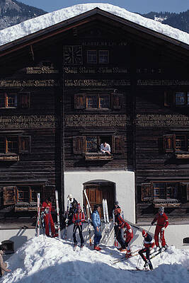 Skiers in Front of Alpine Chalet Wall Art