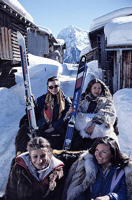 Ski Enthusiasts in Snowy Village Wall Art