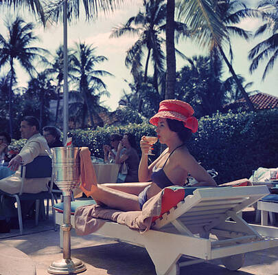 Woman Relaxing at Poolside Wall Art