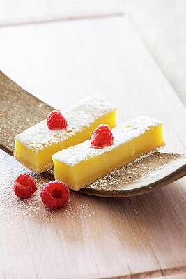 Lemon Bars With Powdered Sugar And Raspberries Print