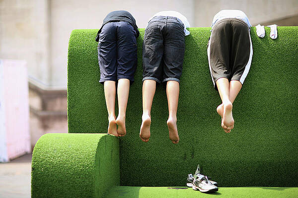 Wall Art featuring the photograph Londoners Enjoy The Warm Weather by Dan Kitwood