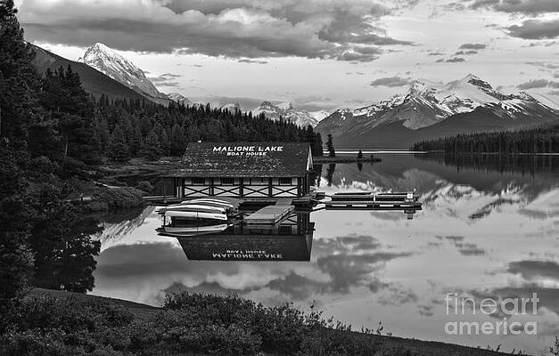 Wall Art featuring the photograph Maligne Lake Boathouse Fiery Summer Sunset Black And White by Adam Jewell