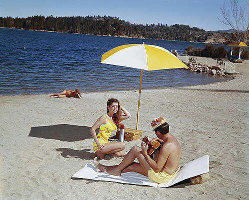 Wall Art featuring the photograph Man Playing Guitar While Woman Dancing by Tom Kelley Archive