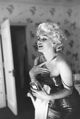 Wall Art featuring the photograph Marilyn Monroe With Chanel No. 5 by Michael Ochs Archives