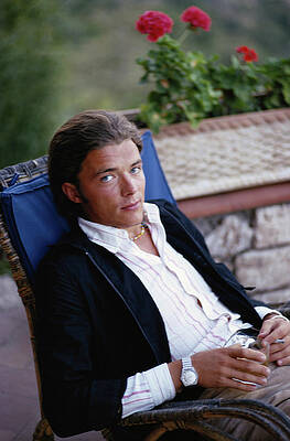 Young Man Relaxing in Chair Wall Art