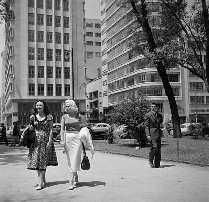 Two Women Walking in Urban Setting Wall Art