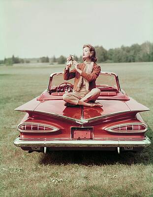 Car Photograph - Model Sitting On A Chevrolet Convertible by John Rawlings