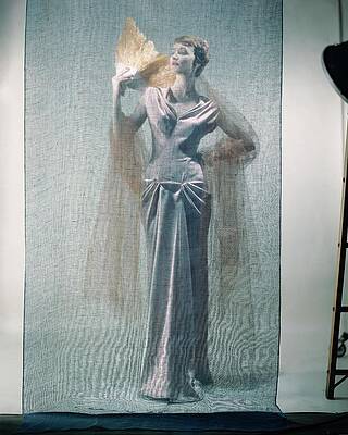 Wall Art featuring the photograph Model With Fan Behind Scrim by Erwin Blumenfeld