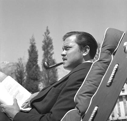 Man Relaxing with Pipe on Lounge Chair Wall Art