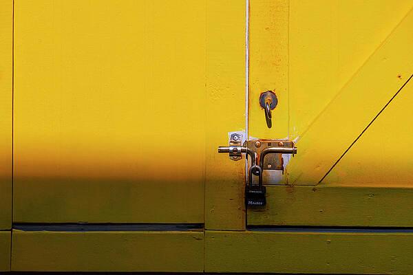 Yellow Wall Art featuring the digital art Pad Lock On Yellow Wooden Door by Laura Diez