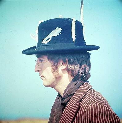 Man in Stylish Feathered Hat Photograph