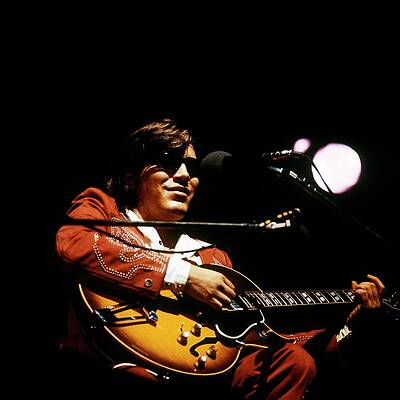 Performer in Red Suit with Guitar Photograph
