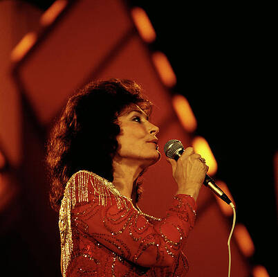 Singer Performing on Stage Photograph