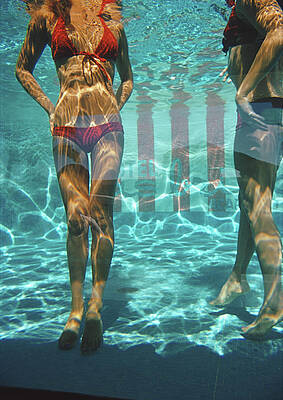 Underwater Swimmers in Red Bikinis Wall Art