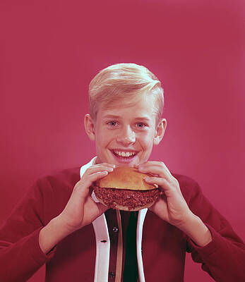 Smiling Boy Enjoying a Burger Wall Art
