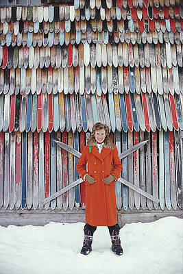 Woman in Red Coat with Skis Wall Art