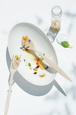 Remnants Of Wild Herb Salad On A Plate With Salad Servers Print