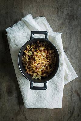 Roast Onions In A Wrought Iron Pot On A Light Linen Cloth On A Wooden Table Print
