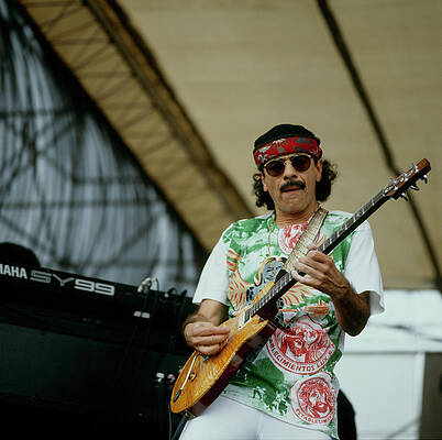 Famous Guitarist Performing on Stage Photograph