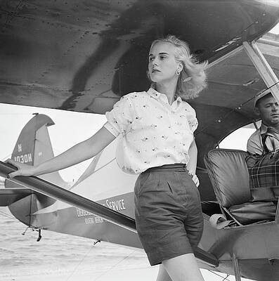 Stylish Woman by a Seaplane Wall Art