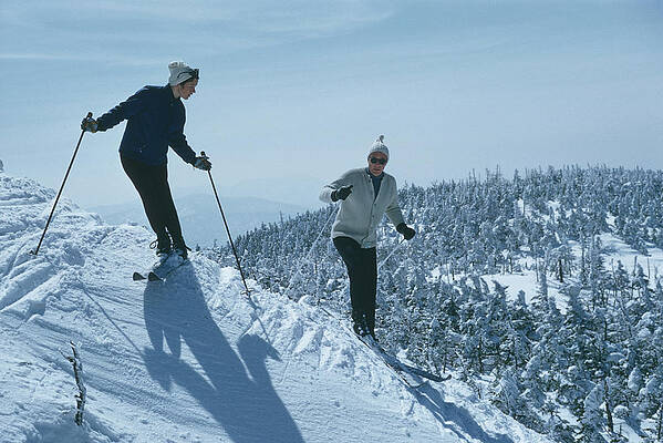 Skiers Enjoying a Snowy Mountain Descent Wall Art