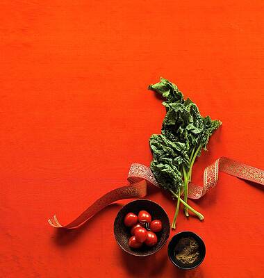Spinach Leaves, Two Bowls Of Tomatoes And Cumin On A Red Surface Print