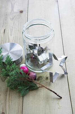 Star-shaped Cookie Cutter In A Screw Top Jar, Next To It A Pine Branch And Christmas Ornaments Print
