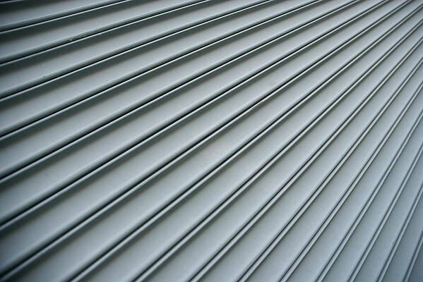 Wall Art featuring the photograph Steel Shutter Lines Background Diagonal by Peskymonkey