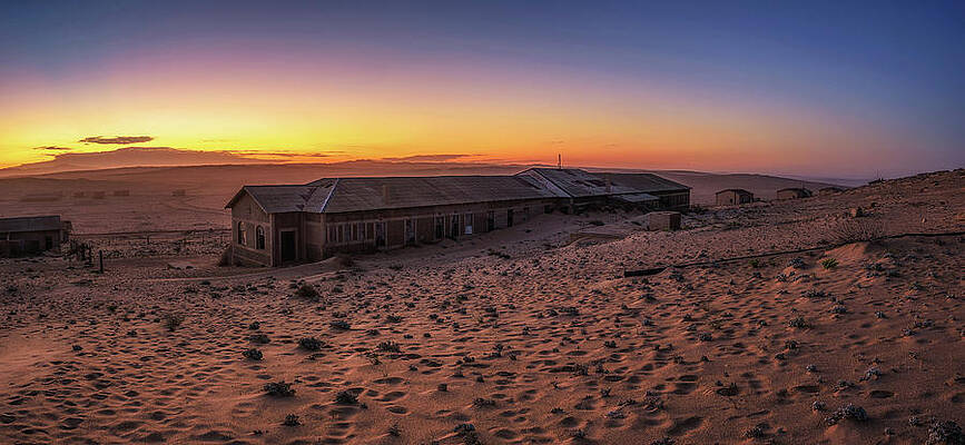 Sunrise Wall Art featuring the photograph Sunrise Above The Abandoned Houses Of Kolmanskop Ghost Town, Namibia. by Miroslav Liska