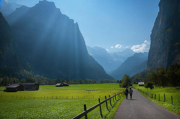 Waterfall Photograph - Swiss Hikers In Lauterbrunnen Switzerland by Owen Weber