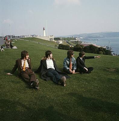 Band Relaxing on a Coastal Hill Photograph