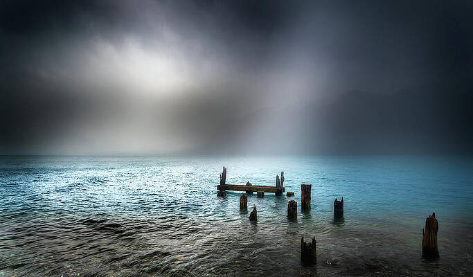 Moody Wall Art featuring the photograph The Old Glacial Jetty by Monamifoto